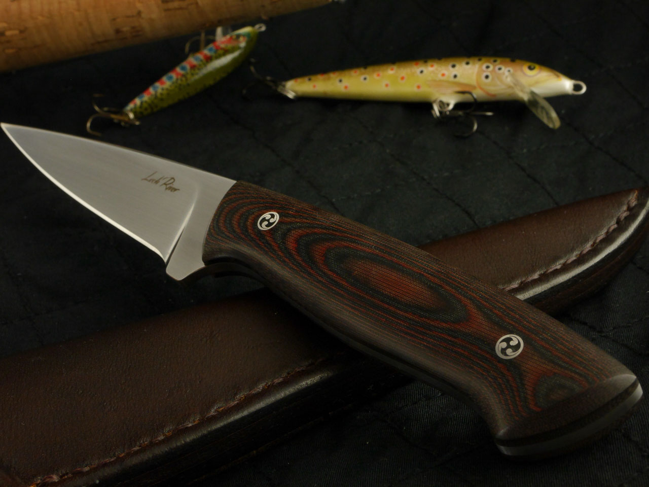 Custom made Fishing knife with a brown Micarta handle and an extremely fine tip. Blade made from N690 Steal